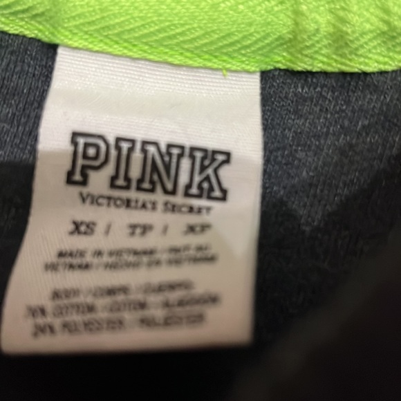 Extra small fits more like a small Victoria’s Secret pull over black and green - Picture 2 of 3